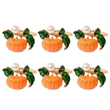 Load image into Gallery viewer, Faux Pearl Pumpkin Rings by Allthingscurated come in a set of 6 napkin rings. Each ring is crafted with exquisite detail of a pumpkin design and adorned with a faux pearl to bring a touch of sophistication. Perfect for all fall festivities, from Halloween to Thanksgiving.
