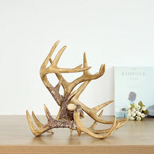 Load image into Gallery viewer, Antler Wine Bottle Holder by Allthingscurated is hand-crafted from resin and hand-painted to emulate the look of genuine antlers. Beautiful and sculptural, it’s a great gift for any occasion as well as a perfect addition to give your winter tablescape a cabin vibe. On its own, it’s a decorative, ornamental piece that gives a luxurious look to your mantel, tabletop or shelf. Measuring approximately 33cm or 13 inches in height, 35cm or 13.7 inches wide and a depth of 23cm or 9 inches.