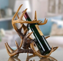 Load image into Gallery viewer, Antler Wine Bottle Holder by Allthingscurated is hand-crafted from resin and hand-painted to emulate the look of genuine antlers. Beautiful and sculptural, it’s a great gift for any occasion as well as a perfect addition to give your winter tablescape a cabin vibe. On its own, it’s a decorative, ornamental piece that gives a luxurious look to your mantel, tabletop or shelf. Measuring approximately 33cm or 13 inches in height, 35cm or 13.7 inches wide and a depth of 23cm or 9 inches.