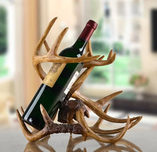 Load image into Gallery viewer, Antler Wine Bottle Holder by Allthingscurated is hand-crafted from resin and hand-painted to emulate the look of genuine antlers. Beautiful and sculptural, it’s a great gift for any occasion as well as a perfect addition to give your winter tablescape a cabin vibe. On its own, it’s a decorative, ornamental piece that gives a luxurious look to your mantel, tabletop or shelf. Measuring approximately 33cm or 13 inches in height, 35cm or 13.7 inches wide and a depth of 23cm or 9 inches.