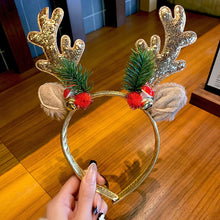 Load image into Gallery viewer, Add some sparkle to your holiday party with these Glittering Antler Christmas Headbands by Allthingscurated. Comes in 2 designs in Red or Gold. These beautiful accessories are perfect for hyping up the festive atmosphere.