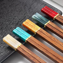 Load image into Gallery viewer, Faux Jade Wooden Chopsticks by Allthingscurated feature five striking colors with jade embellishment crafted from high-grade resin that is contemporary in design yet practical in everyday dining or special occasions. Come as a set of 5 pairs or 10 pairs. Shown here is a set in assorted colors.
