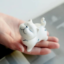 Load image into Gallery viewer, Petite Butterfly Orchid Porcelain by Allthingscurated is handmade with exquisite craftsmanship. Featuring beautiful, hand-painted blue butterfly orchids on white porcelain, the dainty design exudes an elegant charm and a touch of playfulness with its naughty and oh-so-cute expression. Small yet exquisite, it will charm any cat lovers and bring joy to any room.