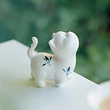 Load image into Gallery viewer, Petite Butterfly Orchid Porcelain by Allthingscurated is handmade with exquisite craftsmanship. Featuring beautiful, hand-painted blue butterfly orchids on white porcelain, the dainty design exudes an elegant charm and a touch of playfulness with its naughty and oh-so-cute expression. Small yet exquisite, it will charm any cat lovers and bring joy to any room.