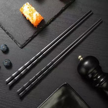 Load image into Gallery viewer, Bamboo Design Chinese Chopsticks by Allthingscurated are made from durable fiberglass polymer and heat-resistance. Stylish and sleek, the tapered end features an anti-slip design for easy and secure food picking. Enjoy 10 pairs of these high-quality chopsticks for all your Asian cuisine needs.