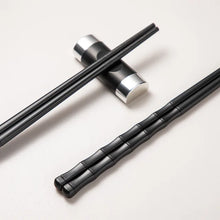 Load image into Gallery viewer, Bamboo Design Chinese Chopsticks by Allthingscurated are made from durable fiberglass polymer and heat-resistance. Stylish and sleek, the tapered end features an anti-slip design for easy and secure food picking. Enjoy 10 pairs of these high-quality chopsticks for all your Asian cuisine needs.