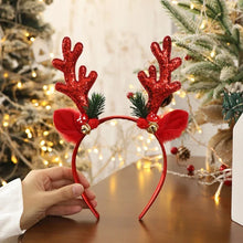 Load image into Gallery viewer, Add some sparkle to your holiday party with these Glittering Antler Christmas Headbands by Allthingscurated. Comes in 2 designs in Red or Gold. These beautiful accessories are perfect for hyping up the festive atmosphere. Featured here is the Red Antler headband embellished with bells.