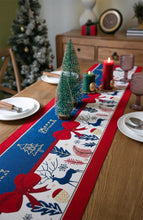 Load image into Gallery viewer, Holiday Bow and Elk Table Runners by Allthingscurated are inspired by all the notable symbols of Christmas like the merry bow, Christmas tree, elk and snowflakes. The jacquard table runners come in vibrant hues of blue and green with beautiful embroidery and complete with pretty tassels. Available in 9 sizes. They are perfect holiday decoration to bring a festive touch to. Your table setting.