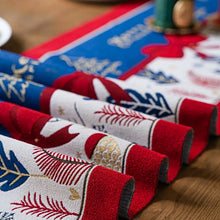 Load image into Gallery viewer, Holiday Bow and Elk Table Runners by Allthingscurated are inspired by all the notable symbols of Christmas like the merry bow, Christmas tree, elk and snowflakes. The jacquard table runners come in vibrant hues of blue and green with beautiful embroidery and complete with pretty tassels. Available in 9 sizes. They are perfect holiday decoration to bring a festive touch to. Your table setting.