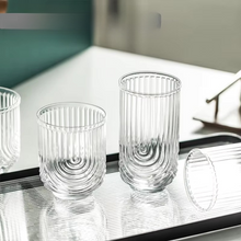 Load image into Gallery viewer, Brix U Design Drinking Glass by Allthingscurated is made of lead-free, high-quality glass and spots a sexy U shape ribbed pattern that provides a comfortable grip when holding. These glasses is the perfect combination of style and functionality, making it suitable for everyday use and a wide variety of beverage from iced café lattes to cocktails, juices and whiskeys. It’s also dishwasher-safe for easy cleaning. Comes in 370ml, 410ml and 430ml or, 12 ounce, 14 ounce and 14.5 ounce.