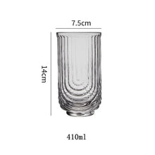 Load image into Gallery viewer, Brix U Design Drinking Glass by Allthingscurated is made of lead-free, high-quality glass and spots a sexy U shape ribbed pattern that provides a comfortable grip when holding. These glasses is the perfect combination of style and functionality, making it suitable for everyday use and a wide variety of beverage from iced café lattes to cocktails, juices and whiskeys. It’s also dishwasher-safe for easy cleaning. Shown here is tall glass in 410ml or 14 ounce.