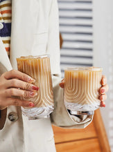 Load image into Gallery viewer, Brix U Design Drinking Glass by Allthingscurated is made of lead-free, high-quality glass and spots a sexy U shape ribbed pattern that provides a comfortable grip when holding. These glasses is the perfect combination of style and functionality, making it suitable for everyday use and a wide variety of beverage from iced café lattes to cocktails, juices and whiskeys. It’s also dishwasher-safe for easy cleaning. Comes in 370ml, 410ml and 430ml or, 12 ounce, 14 ounce and 14.5 ounce.
