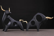 Load image into Gallery viewer, Brooklyn Bull Sculptures by Allthingscurated capture the elegance and dramatic aura of the auspicious animal in a sleek, modern design with matte black finish and gold-accented horns. A visually-appealing and timeless collection, it’s a fashionable piece to add to any contemporary home and spaces. And perfect as a gift for those with a Taurus horoscope or Chinese Ox zodiac sign.