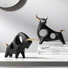 Load image into Gallery viewer, Brooklyn Bull Sculptures by Allthingscurated capture the elegance and dramatic aura of the auspicious animal in a sleek, modern design with matte black finish and gold-accented horns. A visually-appealing and timeless collection, it’s a fashionable piece to add to any contemporary home and spaces. And perfect as a gift for those with a Taurus horoscope or Chinese Ox zodiac sign.
