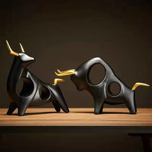 Load image into Gallery viewer, Brooklyn Bull Sculptures by Allthingscurated capture the elegance and dramatic aura of the auspicious animal in a sleek, modern design with matte black finish and gold-accented horns. A visually-appealing and timeless collection, it’s a fashionable piece to add to any contemporary home and spaces. And perfect as a gift for those with a Taurus horoscope or Chinese Ox zodiac sign.