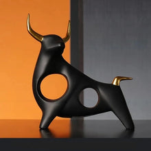 Load image into Gallery viewer, Brooklyn Bull Sculptures by Allthingscurated capture the elegance and dramatic aura of the auspicious animal in a sleek, modern design with matte black finish and gold-accented horns. A visually-appealing and timeless collection, it’s a fashionable piece to add to any contemporary home and spaces. And perfect as a gift for those with a Taurus horoscope or Chinese Ox zodiac sign.