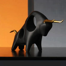 Load image into Gallery viewer, Brooklyn Bull Sculptures by Allthingscurated capture the elegance and dramatic aura of the auspicious animal in a sleek, modern design with matte black finish and gold-accented horns. A visually-appealing and timeless collection, it’s a fashionable piece to add to any contemporary home and spaces. And perfect as a gift for those with a Taurus horoscope or Chinese Ox zodiac sign.