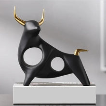 Load image into Gallery viewer, Brooklyn Bull Sculptures by Allthingscurated capture the elegance and dramatic aura of the auspicious animal in a sleek, modern design with matte black finish and gold-accented horns. A visually-appealing and timeless collection, it’s a fashionable piece to add to any contemporary home and spaces. And perfect as a gift for those with a Taurus horoscope or Chinese Ox zodiac sign. Featured here is the Fearless Bull Sculpture.