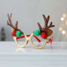 Load image into Gallery viewer, Antler Christmas Party Glasses by Allthingscurated are the perfect fun accessory for festive parties and gatherings during the holiday season. Their unique design and cheerful holiday style make them great props for creating memorable moments an happy Instagram posts to capture the joy of the season. Featured here is the Brown Antler design with Red and Green pom poms.