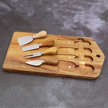 Load image into Gallery viewer, This 5-piece Magnetic Wood Cheese Board Set by Allthingscurated is crafted from Acacia wood and comes with 4 pieces of essential cheese tools. It’s a well-organized and cleverly-designed set featuring magnets on the board to hold all the tools securely for convenient storage. This set is the ultimate gift for house-warming and cheese lovers. Tools include a cheese fork, a flat cheese knife, a spade knife and a narrow plane knife.