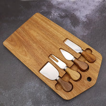Load image into Gallery viewer, This 5-piece Magnetic Wood Cheese Board Set by Allthingscurated is crafted from Acacia wood and comes with 4 pieces of essential cheese tools. It’s a well-organized and cleverly-designed set featuring magnets on the board to hold all the tools securely for convenient storage. This set is the ultimate gift for house-warming and cheese lovers. Tools include a cheese fork, a flat cheese knife, a spade knife and a narrow plane knife.