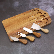 Load image into Gallery viewer, This 5-piece Magnetic Wood Cheese Board Set by Allthingscurated is crafted from Acacia wood and comes with 4 pieces of essential cheese tools. It’s a well-organized and cleverly-designed set featuring magnets on the board to hold all the tools securely for convenient storage. This set is the ultimate gift for house-warming and cheese lovers. Tools include a cheese fork, a flat cheese knife, a spade knife and a narrow plane knife.