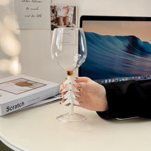 Load image into Gallery viewer, These charming Christmas Tree Stem Glass by Allthingscurated features a sculptural 3D design on the stem. Comes in classic green or bright white, it adds a festive vibe to your holiday gatherings. These glasses make thoughtful gifts for your loved ones. Featured here is the stem glass in white tree design.