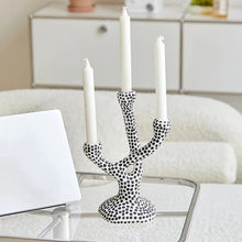 Load image into Gallery viewer, Whimsical Polka Dot Ceramic Candelabra by Allthingscurated combines abstract design with a touch of quirkiness, making it an aesthetically-pleasing piece for any modern and stylish homes. Perfect for lighting up your space with a touch of charm and personality; or as a decorative piece on its own.