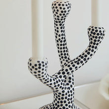 Load image into Gallery viewer, Whimsical Polka Dot Ceramic Candelabra by Allthingscurated combines abstract design with a touch of quirkiness, making it an aesthetically-pleasing piece for any modern and stylish homes. Perfect for lighting up your space with a touch of charm and personality; or as a decorative piece on its own.