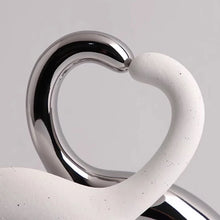 Load image into Gallery viewer, These Cat Couple Love Figurines by Allthingscurated are perfect for cat lovers. Made of ceramic, they feature a pair of cute and whimsical cats in contrasting colors, with their tails entwined to form a heart shape. A romantic and unique gift for any occasion.