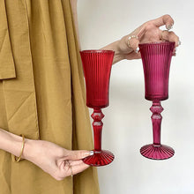Load image into Gallery viewer, Cecily Flute Glasses by Allthingscurated feature a medieval-inspired vertical ridged design that provides a unique texture with an elegant touch. The long, sturdy stem ensures a steady hold while the jewel tones add a touch of sophistication to any celebration. Designed to complement your favorite wines, these glasses are perfect for entertaining and will brighten up any table.
