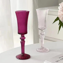 Load image into Gallery viewer, Cecily Flute Glasses by Allthingscurated feature a medieval-inspired vertical ridged design that provides a unique texture with an elegant touch. The long, sturdy stem ensures a steady hold while the jewel tones add a touch of sophistication to any celebration. Designed to complement your favorite wines, these glasses are perfect for entertaining and will brighten up any table.