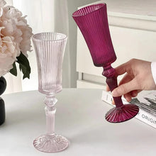 Load image into Gallery viewer, Cecily Flute Glasses by Allthingscurated feature a medieval-inspired vertical ridged design that provides a unique texture with an elegant touch. The long, sturdy stem ensures a steady hold while the jewel tones add a touch of sophistication to any celebration. Designed to complement your favorite wines, these glasses are perfect for entertaining and will brighten up any table.