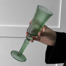 Load image into Gallery viewer, Cecily Flute Glasses by Allthingscurated feature a medieval-inspired vertical ridged design that provides a unique texture with an elegant touch. The long, sturdy stem ensures a steady hold while the jewel tones add a touch of sophistication to any celebration. Designed to complement your favorite wines, these glasses are perfect for entertaining and will brighten up any table.