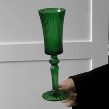 Load image into Gallery viewer, Cecily Flute Glasses by Allthingscurated feature a medieval-inspired vertical ridged design that provides a unique texture with an elegant touch. The long, sturdy stem ensures a steady hold while the jewel tones add a touch of sophistication to any celebration. Designed to complement your favorite wines, these glasses are perfect for entertaining and will brighten up any table. Featured here is flute glass in Dark Green.