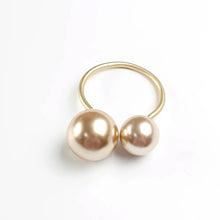 Load image into Gallery viewer, Faux Pearls Napkin Rings in a set of 6 by Allthingscurated are adorned with big and small pearls to create an overall look of elegance and sophistication. They are perfect for special occasions. Come available in 4 different color combinations. Featured here is Champagne Gold Set