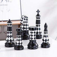 Load image into Gallery viewer, Checkered 6-piece Chess Set by Allthingscurated is both elegant and delightfully unique. Designed with a striking, graphic pattern in black and white, it adds a touch of sophistication to any space, whether your home décor style is modern or traditional. Made of porcelain, this decorative set is an ideal gift for any chess lovers.