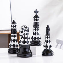 Load image into Gallery viewer, Checkered 6-piece Chess Set by Allthingscurated is both elegant and delightfully unique. Designed with a striking, graphic pattern in black and white, it adds a touch of sophistication to any space, whether your home décor style is modern or traditional. Made of porcelain, this decorative set is an ideal gift for any chess lovers.