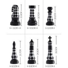 Load image into Gallery viewer, Checkered 6-piece Chess Set by Allthingscurated is both elegant and delightfully unique. Designed with a striking, graphic pattern in black and white, it adds a touch of sophistication to any space, whether your home décor style is modern or traditional. Made of porcelain, this decorative set is an ideal gift for any chess lovers.