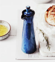 Load image into Gallery viewer, Japanese Style Ceramic Oil Vinegar Cruet by Allthingscurated is crafted from kiln-fired glazed porcelain with a glossy and smooth finish. Spots a tapered, elegant silhouette, it is perfect for storing and serving condiments from soy sauce and sesame oil, to olive oil and vingegar. Comes in 5 beautiful colors.