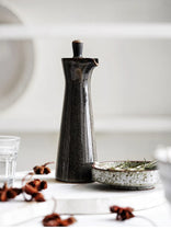 Load image into Gallery viewer, Japanese Style Ceramic Oil Vinegar Cruet by Allthingscurated is crafted from kiln-fired glazed porcelain with a glossy and smooth finish. Spots a tapered, elegant silhouette, it is perfect for storing and serving condiments from soy sauce and sesame oil, to olive oil and vingegar. Comes in 5 beautiful colors.