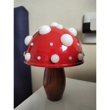 Load image into Gallery viewer, Whimsical Mushroom LED Lamp by Allthingscurated is unique and decorative, yet functional. The enchanting design features a playful mushroom silhouette, complete with red-capped spots lampshade to bring a touch of whimsy to any room. It makes a perfect gift for someone with a special affinity for mushrooms. Comes in a cordless and corded version with 2 lamp base colors.