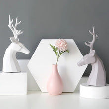 Load image into Gallery viewer, This beautiful Deer Head Bust sculpture is made of resin and comes available in 4 colors of black, white, gray and teal. Measuring 26cm or 10 inches in height and 11.5cm or 4.5 inches in width. This figurine spots a contemporary design with sculptural form inspired by Origami. This decorative piece will add timeless elegance to your space year-round. Perfect for festive tablescapes, mantels and shelves.