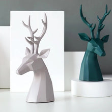 Load image into Gallery viewer, This beautiful Deer Head Bust sculpture is made of resin and comes available in 4 colors of black, white, gray and teal. Measuring 26cm or 10 inches in height and 11.5cm or 4.5 inches in width. This figurine spots a contemporary design with sculptural form inspired by Origami. This decorative piece will add timeless elegance to your space year-round. Perfect for festive tablescapes, mantels and shelves.