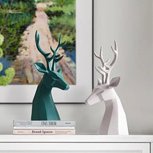 Load image into Gallery viewer, This beautiful Deer Head Bust sculpture is made of resin and comes available in 4 colors of black, white, gray and teal. Measuring 26cm or 10 inches in height and 11.5cm or 4.5 inches in width. This figurine spots a contemporary design with sculptural form inspired by Origami. This decorative piece will add timeless elegance to your space year-round. Perfect for festive tablescapes, mantels and shelves.