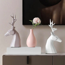 Load image into Gallery viewer, This beautiful Deer Head Bust sculpture is made of resin and comes available in 4 colors of black, white, gray and teal. Measuring 26cm or 10 inches in height and 11.5cm or 4.5 inches in width. This figurine spots a contemporary design with sculptural form inspired by Origami. This decorative piece will add timeless elegance to your space year-round. Perfect for festive tablescapes, mantels and shelves.