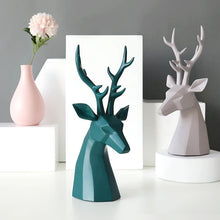 Load image into Gallery viewer, This beautiful Deer Head Bust sculpture is made of resin and comes available in 4 colors of black, white, gray and teal. Measuring 26cm or 10 inches in height and 11.5cm or 4.5 inches in width. This figurine spots a contemporary design with sculptural form inspired by Origami. This decorative piece will add timeless elegance to your space year-round. Perfect for festive tablescapes, mantels and shelves.