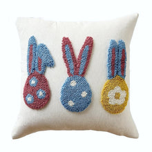 Load image into Gallery viewer, Spring Melody Embroidered Cushion Covers by Allthingscurated feature charming seasonal details to transition your home into Spring and Easter effortlessly. Each cover showcases meticulous embroidery to add depth and visual interest to your sofa and furniture. Design featured 3 Easter Bunnies in pink, blue, white and yellow on 40 by 40cm or 15.6 by 15.6 inches white cover.