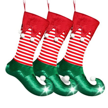 Load image into Gallery viewer, Holiday Elf Stocking by Allthingscurated are inspired by the signature curly-toed boots and striped tights that are worn by the little elves. The cute design is both fun and bright in traditional Christmas red and green. They are perfect for adding some jolly cheer to your holiday décor.