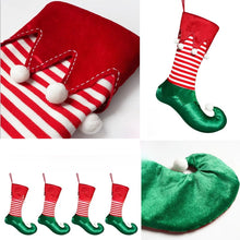 Load image into Gallery viewer, Holiday Elf Stocking by Allthingscurated are inspired by the signature curly-toed boots and striped tights that are worn by the little elves. The cute design is both fun and bright in traditional Christmas red and green. They are perfect for adding some jolly cheer to your holiday décor.
